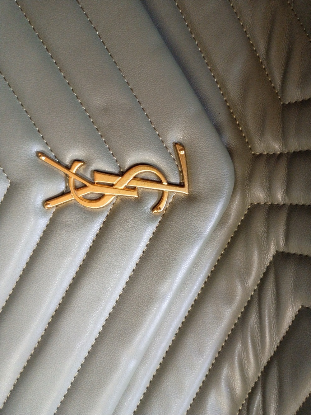 Saint Laurent Gray Quilted Leather Handbag with Gold YSL Logo. Crease at bottom.